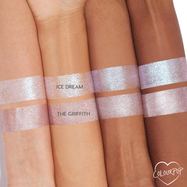 Ice Dream ColourPop Super Shock Shadow swatched across four arms, showing an icy lavender-pink glitter with blue iridescent shift; bands labeled Ice Dream above The Griffith for shade comparison, highlighting a high-shine metallic finish.