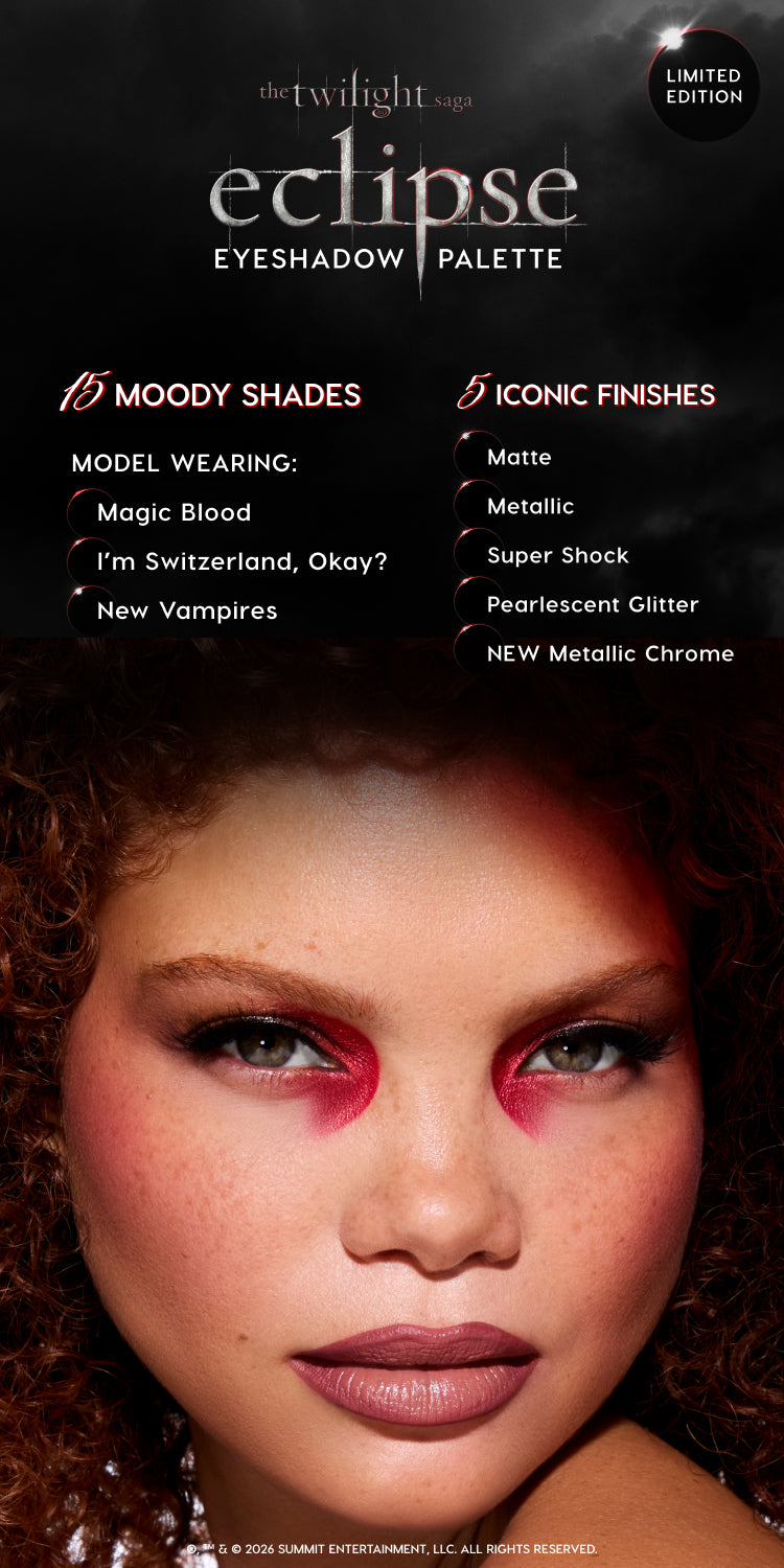 Model wearing bold red and black eye look created with The Twilight Saga Eclipse Eyeshadow Palette, showcasing 15 moody shades and 5 finishes including matte, metallic, Super Shock, pearlescent glitter, and new metallic chrome on a dark, limited-edition promo background.