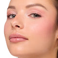 Model showcases Blush Baby ColourPop Shadow Palette, wearing soft pink shimmer eyeshadow with blended rose hues, natural lashes, and rosy blush, finished with glossy nude lips in a clean studio close-up.