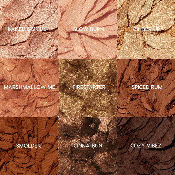 Feelin' Toasty ColourPop Shadow Palette displays nine crushed, labeled shades in a 3x3 grid - Baked Goods, Slow Burn, Cinder Up, Marshmallow Me, Firestarter, Spiced Rum, Smolder, Cinna‑Bun, Cozy Vibez - mix of matte and metallic coppers, caramels, and deep chocolates.