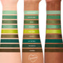Three forearms display swatches of the ColourPop Shadow Palette Just My Luck, a monochrome green edit of nine shades - Chances Are…, Kiss My Hass, So-So, Big Banks, Mary Jane, Olive U, Act Natural, Too Matcha, Charmed - in matte and metallic finishes.