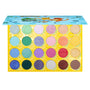 Open ColourPop Shadow Palette Pallet Town shows 24 eyeshadows - mattes and shimmers in blues, greens, purples, pinks, golds, and neutrals - set in a yellow Poké Ball tray with a blue Pokémon lid featuring Pikachu, Charmander, and Bulbasaur.