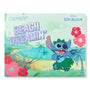 Beach Dreamin’ ColourPop Shadow Palette featuring mint-green packaging with a holographic title and Disney Lilo & Stitch art - Stitch dancing in a grass skirt against a Hawaiian beach scene with palms, hibiscus, and star accents.