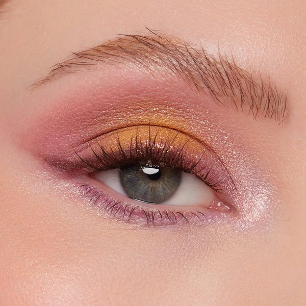 Shimmering eye look showcasing sunset copper-to-gold lid, rose-mauve crease, and lilac inner corner and lower lash line on a single eye with defined lashes; created using the Best Day Ever Shadow Palette, a ColourPop Shadow Palette.