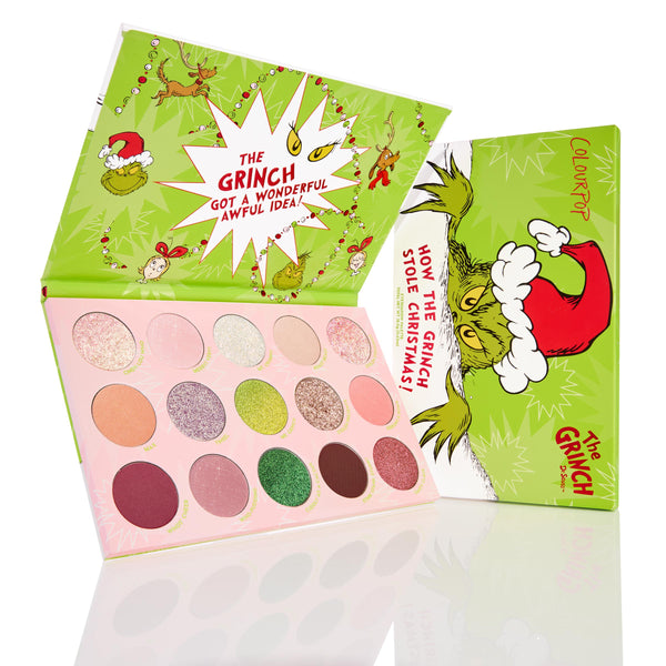 ColourPop How the Grinch Stole Christmas shadow palette showcasing 15 festive matte, shimmer, and glitter shades, opened to reveal pink pans beside bright green holiday packaging with the Grinch in a Santa hat and Whoville artwork.