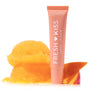 ColourPop Fresh Kiss Glossy Balm in Mango Sorbet stands upright in a coral squeeze tube labeled “Fresh Kiss,” beside two melting scoops of mango sorbet and a mango slice on a clean white background.