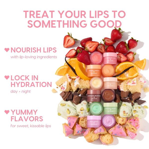 Orange Vanilla Lip Mask jar anchors a vertical stack of pastel lip mask pots, surrounded by fresh strawberries, orange wedges, vanilla bean, cake, chocolate chunks, pistachio gelato, and jelly donut bites, highlighting the ColourPop Lip Care Kit in a bright flat lay.