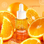 RAYdiate Vitamin C Serum by Fourth Ray Beauty (ColourPop Face Serum) displayed as a dewy dropper bottle beaded with condensation, standing among juicy orange slices on a bright orange backdrop, emphasizing a brightening, glow-boosting formula.