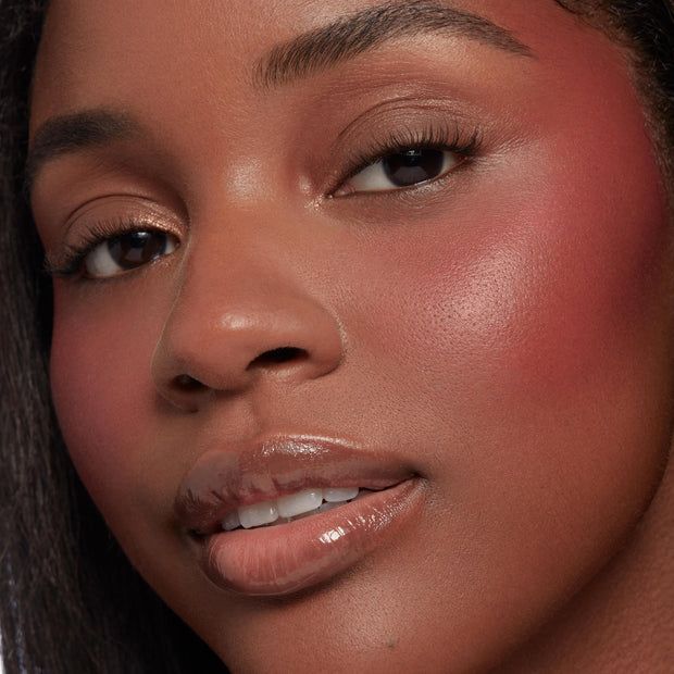 Neutral nude shimmer and matte shades from the Nude Mood ColourPop Shadow Palette blended on the eyelids, captured in a close-up with rosy cheeks and glossy lips, showcasing soft everyday tones and a smooth, luminous finish.