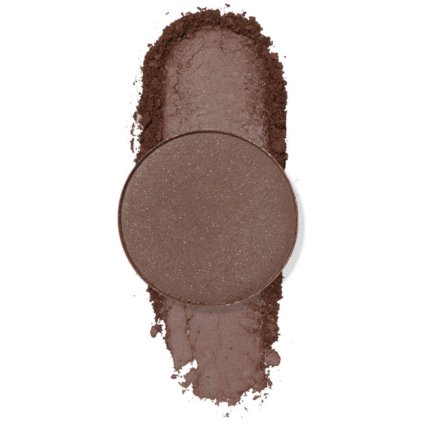 Single round pan displays Float On, a cool deep taupe-brown color with soft shimmer, pressed and lightly crumbled into a vertical swatch on a white background; ColourPop Pressed Powder Shadow for eyes.