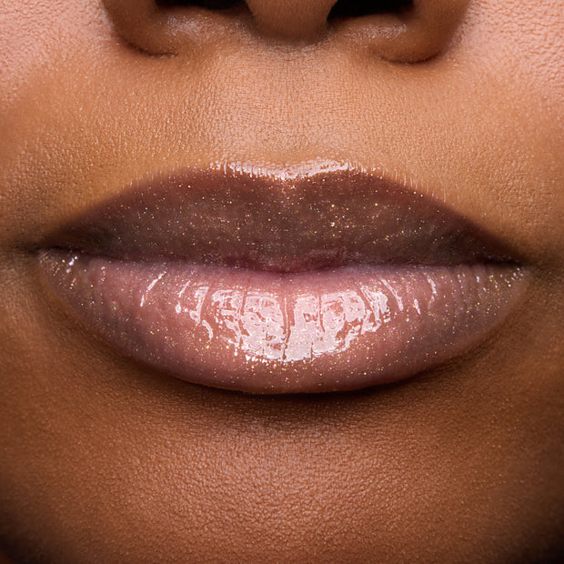 Close-up of models’ lips wearing Colourpop Fresh Kiss Glossy Balm in Buttery Pancakes, showing sheer pink shimmer Lip Gloss & Lip Oil finish on different skin tones against a plain background.