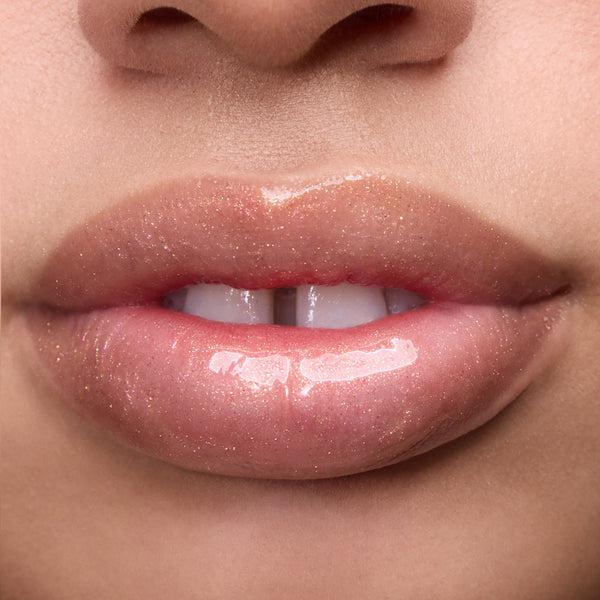Close-up of models’ lips wearing Colourpop Fresh Kiss Glossy Balm in Buttery Pancakes, showing sheer pink shimmer Lip Gloss & Lip Oil finish on different skin tones against a plain background.