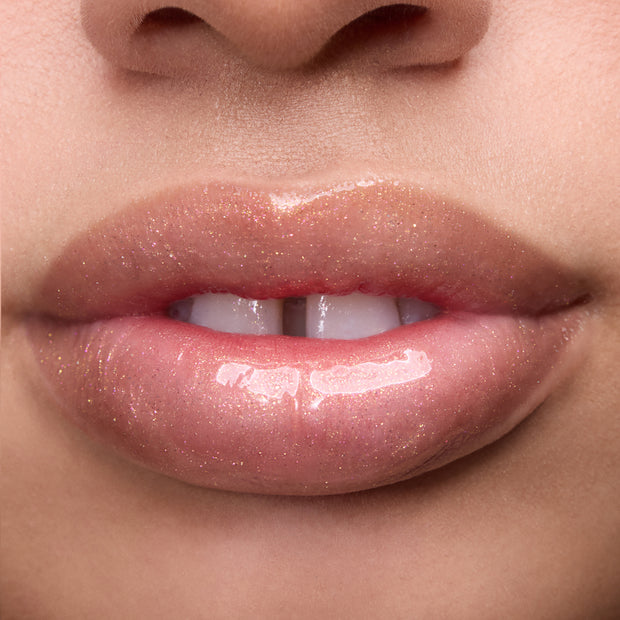 Close-up of models’ lips wearing Colourpop Fresh Kiss Glossy Balm in Buttery Pancakes, showing sheer pink shimmer Lip Gloss & Lip Oil finish on different skin tones against a plain background.