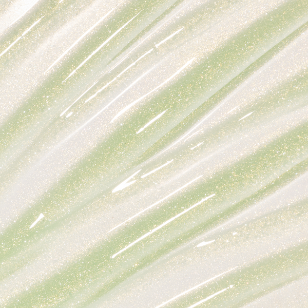 Colourpop Fresh Kiss Glossy Balm in Vanilla Matcha swatched as sheer gold and pale green lip gloss & lip oil with fine gold and silver sparkle streaks across the background, showcasing its shimmery, high-shine finish.