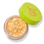 Open jar of ColourPop Glitter Gel, Ogres are Like Onions, shimmering with dense iridescent gold‑peach glitter flakes, rests on a white background with a lime green cap featuring an orange “S” set ajar.