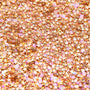 Spinner glitter gel swatch sparkling with metallic gold and iridescent pink star-shaped particles in a clear gel base, ColourPop Glitter Gel texture close-up on a flat surface for face and body looks.