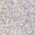 Ur A Firework Glitter Gel shimmering in a macro swatch, packed with iridescent hex glitter and metallic star sequins on a cool lavender base, reflecting rainbow hues; ColourPop Glitter Gel texture close-up.