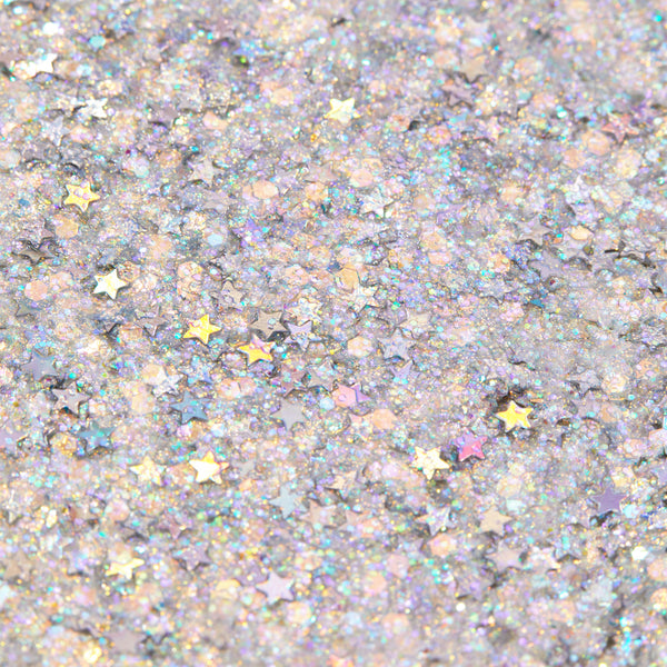Ur A Firework Glitter Gel shimmering in a macro swatch, packed with iridescent hex glitter and metallic star sequins on a cool lavender base, reflecting rainbow hues; ColourPop Glitter Gel texture close-up.