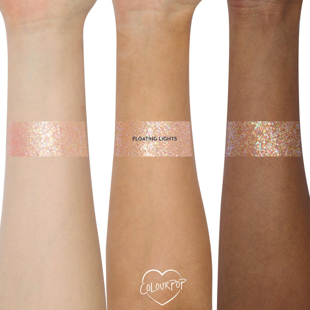 Floating Lights glitter gel from the Disney Tangled and ColourPop Collection swatched on three skin tones, showing the iridescent pink and gold sparkles of this Back In Stock ColourPop full collection set shade.