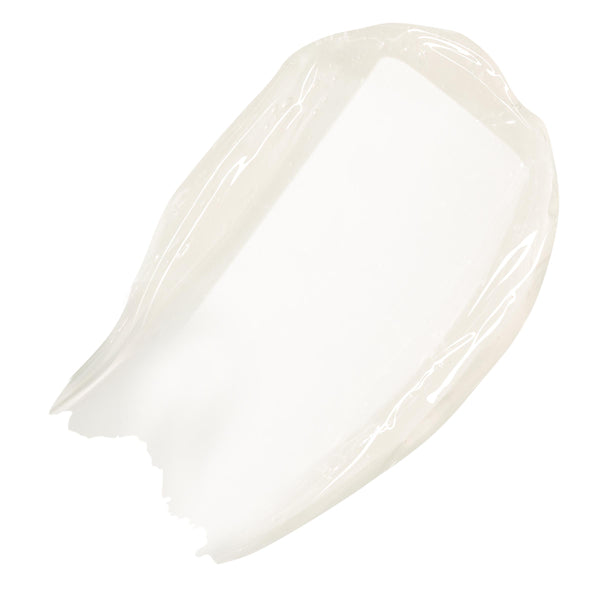 Clear, high-shine swatch of ColourPop Fresh Kiss Glossy Balm in Vanilla Cake, swept in a thick arc on a white background.