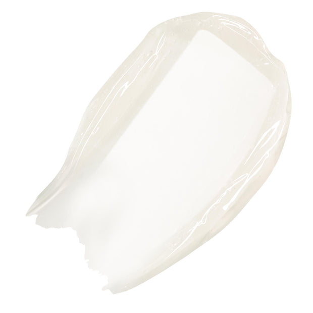 Clear, high-shine swatch of ColourPop Fresh Kiss Glossy Balm in Vanilla Cake, swept in a thick arc on a white background.