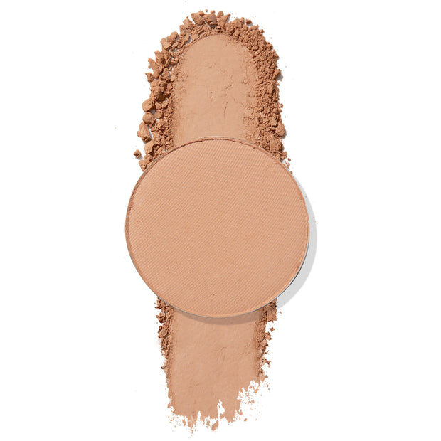 ColourPop Pressed Powder Shadow Gnarly, a single round matte light tan eyeshadow pan, shows a smooth swipe of pigment with softly crumbled edges on a white background.
