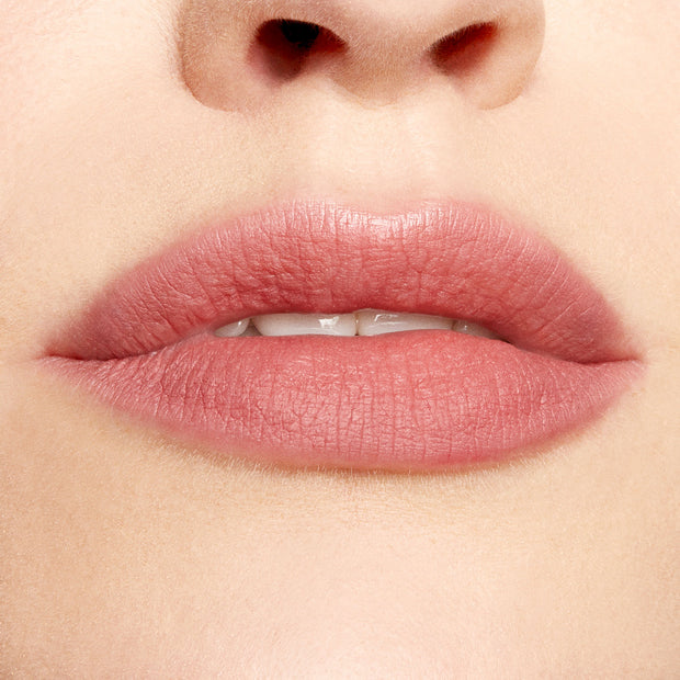 Lips defined and softly filled with Good N Plenty ColourPop Lippie Pencil, a creamy neutral rosy pink lip liner, creating precise matte edges and even color in a clean studio close-up.
