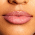 Soft mauve-pink lips lined and filled with the Good N Plenty shade, highlighting the creamy, satin finish and crisp edges of the ColourPop Lippie Pencil in a tight close-up of the mouth against natural skin.