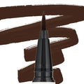 Felt-tip applicator of the Grande BFF Liquid Liner laying down bold chocolate-brown swipes on a white backdrop, emphasizing the precise brush tip and opaque color; ColourPop BFF Liquid Liner product close-up.