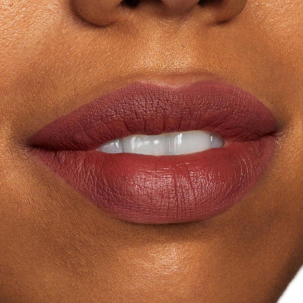 Lips wearing a deep mauve-brown, creamy matte line and fill, showcasing the ColourPop Lippie Pencil in Grunge; close-up beauty swatch with slightly parted lips highlighting precise edges and smooth, full-coverage color payoff.