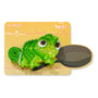 Tangled Pascal Hair Clip securing hair, shaped like a glossy translucent green chameleon with big brown eyes, displayed on a yellow Disney Tangled backing card with ColourPop branding; Tools and Accessories, 1 piece.