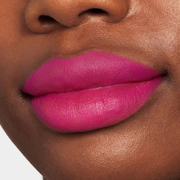 Lips wearing Heart On, a vibrant fuchsia pink, precisely lined and filled with ColourPop Lippie Pencil, shown in a tight close-up with smooth full coverage and crisp edges.