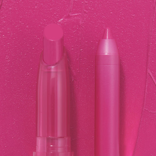Heart Lips ColourPop Lippie Stix + Pencil Set standing side by side, the rounded stix and pointed liner displayed against a creamy hot-pink swatch background, showcasing the bold fuchsia shade for precise lining and full-color fill.