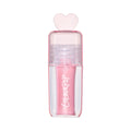 ColourPop 2 Die 4 Ultra Glossy Lip standing upright against a white background, showing its shimmery light pink Heart to Get shade in a clear pink tube topped with a translucent heart-shaped cap for cute, high-shine lip gloss looks.