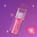 Heart to Get Text Me, JK blush + UGL set with a hot pink ColourPop stick encased in a clear heart-topped tube, floating against a dreamy purple background with soft sparkles, styled for a playful US beauty product shot.
