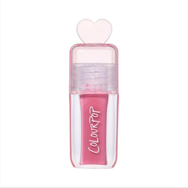 ColourPop Your New Obsession ultra glossy lip in the Heart to Get shade standing upright on a white background, featuring a clear pink tube with bold white logo and a translucent heart-shaped cap for a cute, high-shine lip gloss look.