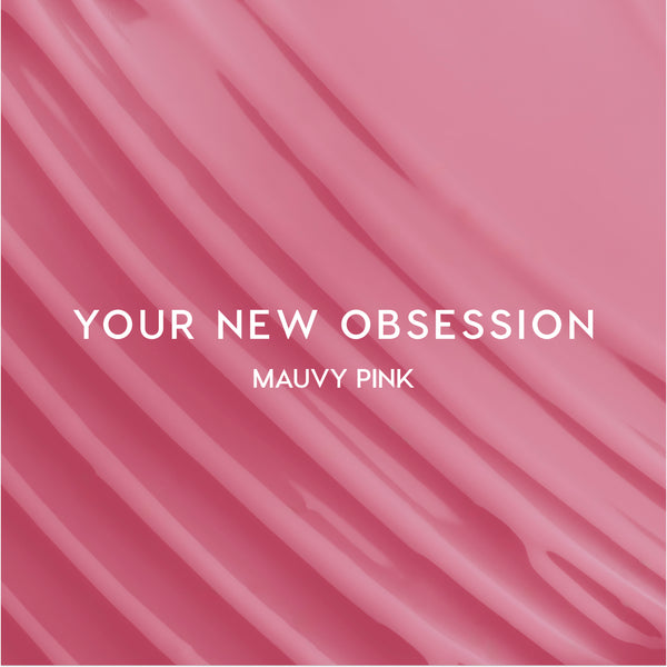 Heart to Get Your New Obsession ultra glossy lip swatch showing smooth mauvy pink gloss streaked diagonally across the frame on a solid background, highlighting the shiny finish and creamy texture for US makeup lovers