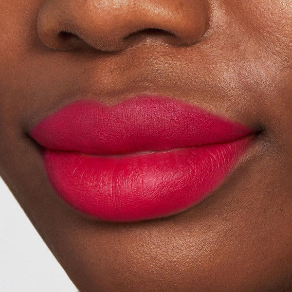 Lips wearing ColourPop Lippie Pencil I Heart This, a vivid hot pink-red lip liner defining and filling lips with a smooth matte finish in a studio close-up.