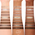 Deja Brew ColourPop Shadow Palette swatches run across three forearms, showcasing ten neutral matte and shimmer eyeshadows - Salted Caramel to Double Shot - labeled and ranging from creamy beige to espresso brown for everyday eye looks.