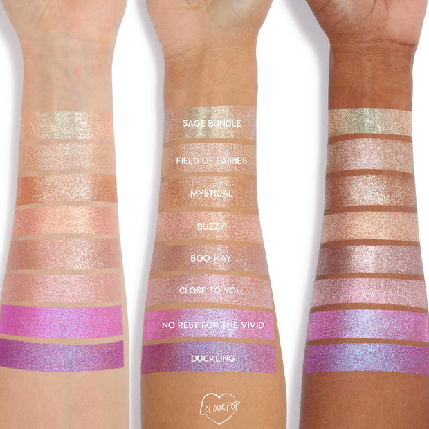 Colourpop Jelly Much Shadow Shiny Penny eyeshadow swatched in shimmery coppery rose tones across three arms of different skin tones, showing metallic payoff and iridescent sparkle in studio lighting for US beauty lovers.