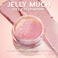 ColourPop Jelly Much Shadow Emo Inside swirls in an open jar, shimmering pink-to-gold duochrome gel catching the light, with wide swatches behind to show metallic payoff and vibrant pigment on a soft pink backdrop.