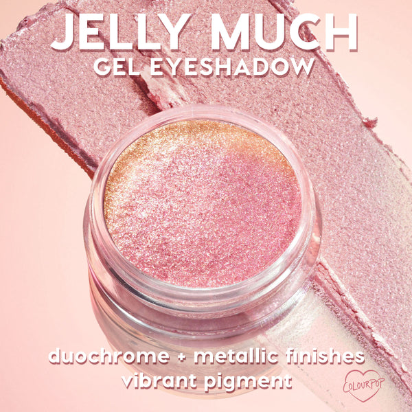 Open jar of ColourPop Jelly Much Shadow in Billionaire sparkles with pink-to-gold duochrome metallic pigment, set atop matching swatches on a soft pink background, highlighting vibrant payoff and gel texture.