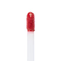 Doe-foot applicator coated in rich rosy-red lip color, displaying the Keep It Classy Ultra Blotted Lip shade from the ColourPop Ultra Blotted Lip line, upright against a clean white background to highlight texture and pigment.