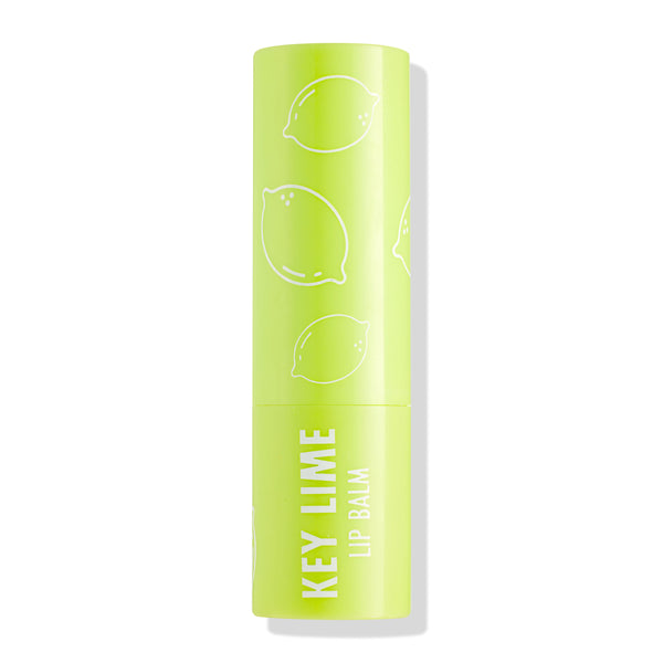 ColourPop Lip Balm tube in Key Lime standing upright with cap on, showcasing a bright lime‑green case with white lime illustrations and “KEY LIME LIP BALM” text, photographed isolated against a clean white background.