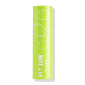 ColourPop Key Lime Lip Scrub tube standing upright with cap on, bright lime‑green packaging printed with white lime illustrations and bold “KEY LIME LIP SCRUB” text, isolated on a white background with a soft shadow.