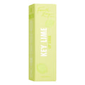 Key Lime Lip Scrub box stands upright, showing Fourth Ray Beauty branding, lime illustrations, and bold “KEY LIME” text on pastel lime‑green packaging, 4.0 g (0.14 oz), isolated on white; a ColourPop lip care product.