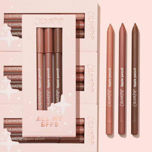 All My BFFs ColourPop Lippie Pencil 3-pack displays three nude lip liner shades - peach, rosy mauve, and deep brown - arranged beside a blush-pink limited-edition box on a soft pink flat lay, highlighting creamy, sharpenable pencils.