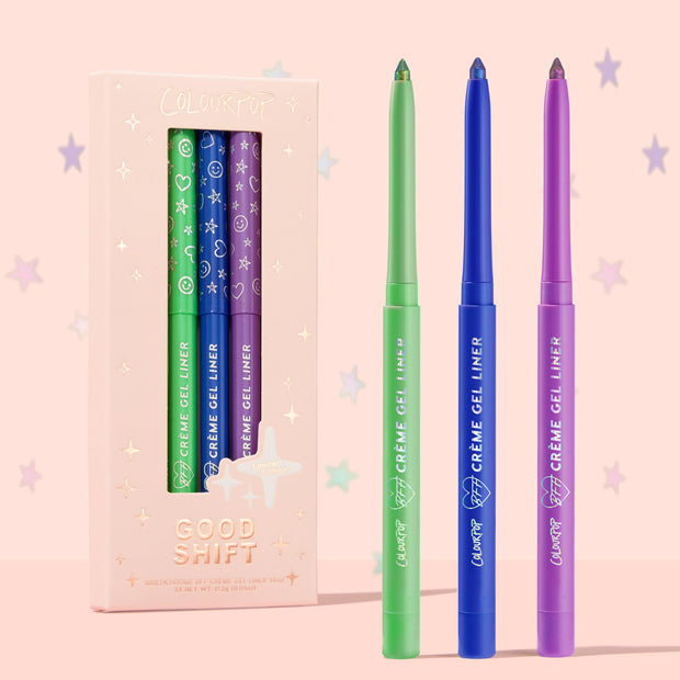 ColourPop Crème Gel Liner Good Shift trio standing uncapped, showcasing green, blue, and purple shimmer tips beside a blush-pink starry box labeled Good Shift Limited Edition; vibrant long-wear crème gel eyeliner set for bold eye looks.