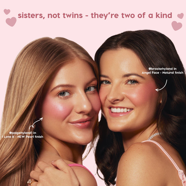 Two smiling women wear Colourpop City Walk liquid blush on their cheeks, one in a dewy pearl finish and the other in a soft natural finish, posing close together against a pink background with the slogan “sisters, not twins – they’re two of a kind.”