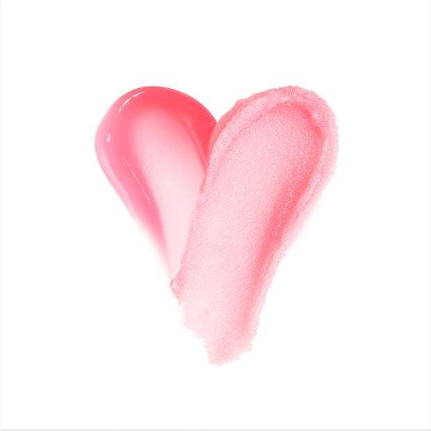 Two pink lip formula swatches - one glossy hot pink, one frosty light pink - form a heart on a white background, showcasing the Merriest Pout Lip Set by Colourpop and highlighting the duo’s glossy tint and sugar‑like texture.